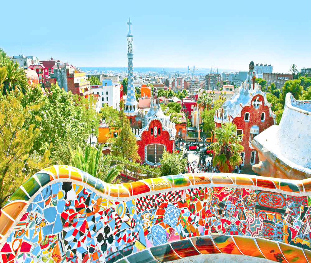 Summer Park Guell over bright blue sky in Barcelona, Spain