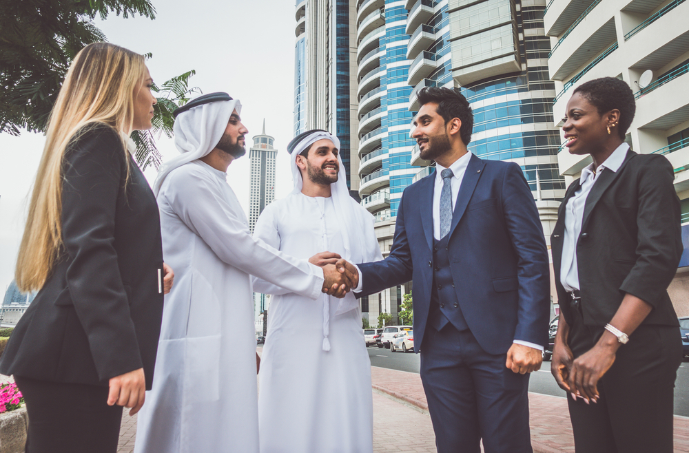 Arab business men shake hands